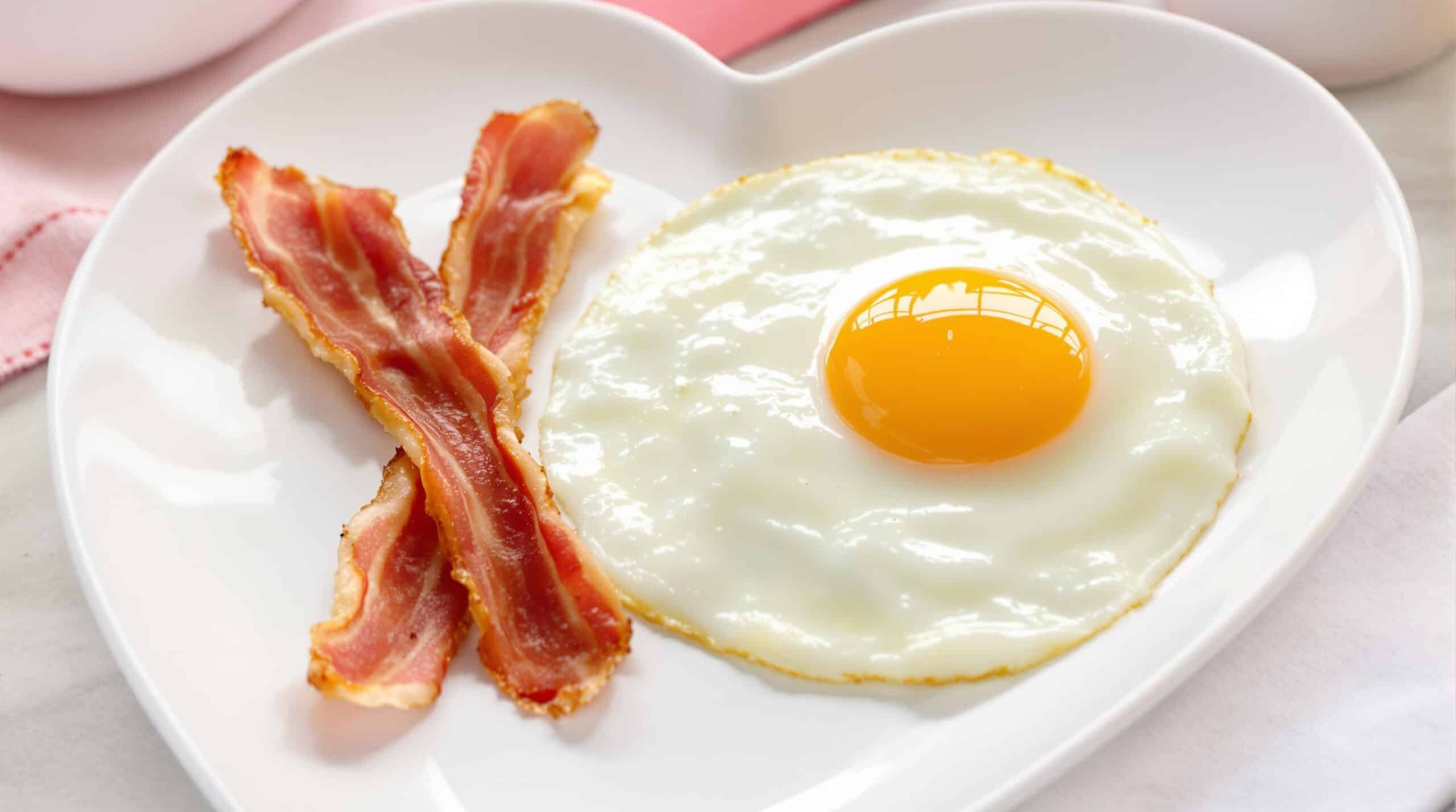 Eggs and bacon on a heart-shaped plate