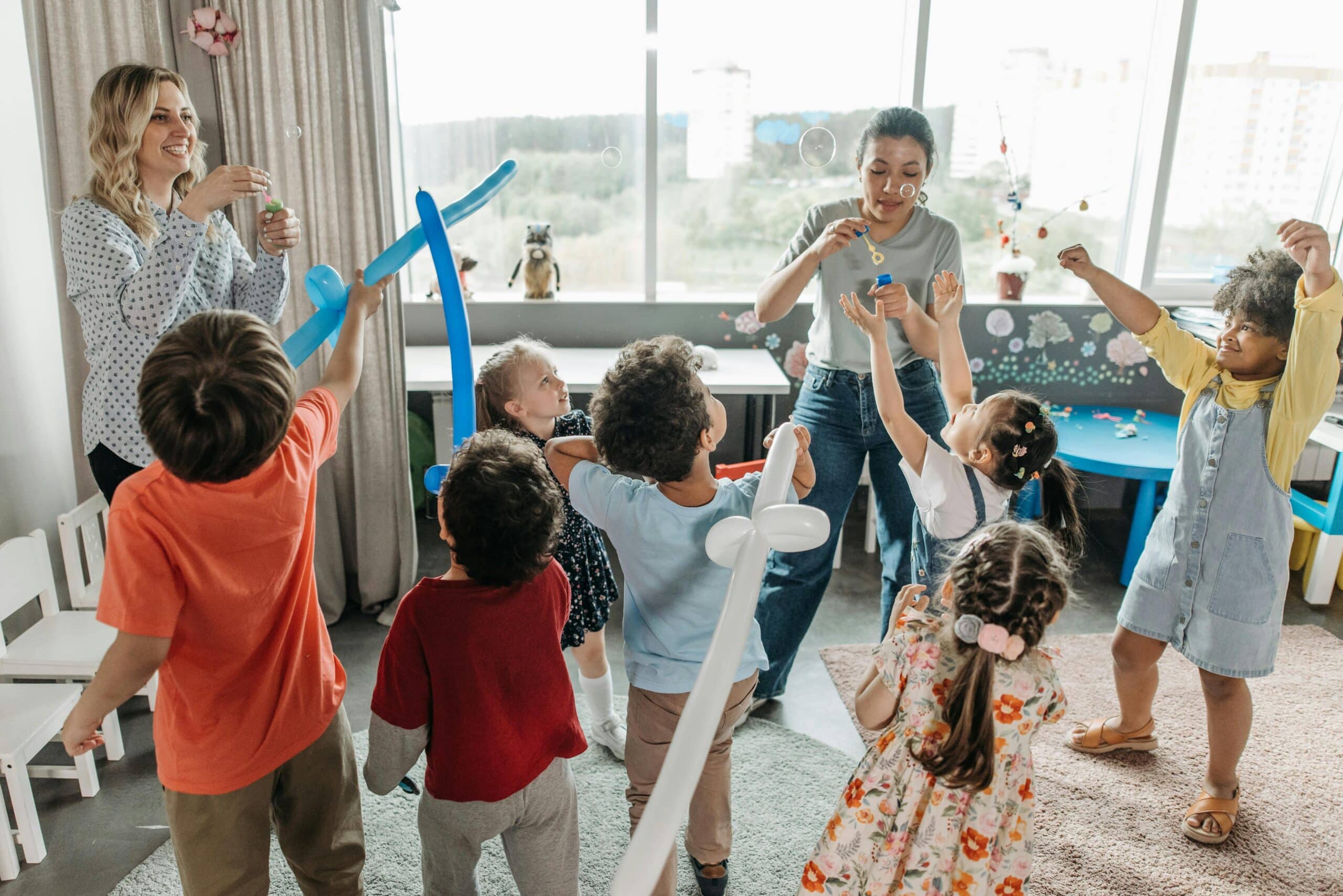 Children play a balloon game at a children's birthday party